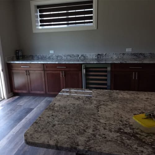 Modern kitchen renovation with custom cabinets and island