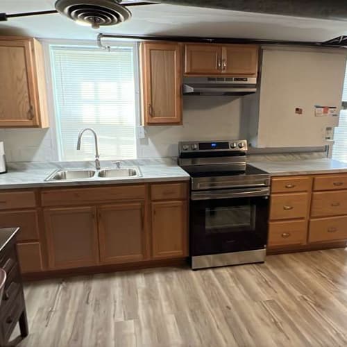 Modern kitchen renovation with custom cabinets and island